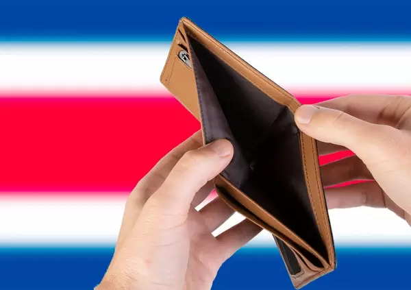 Empty Wallet with Flag of Costa Rica. Recession and Financial Crisis to come with more debt and federal budget deficit?