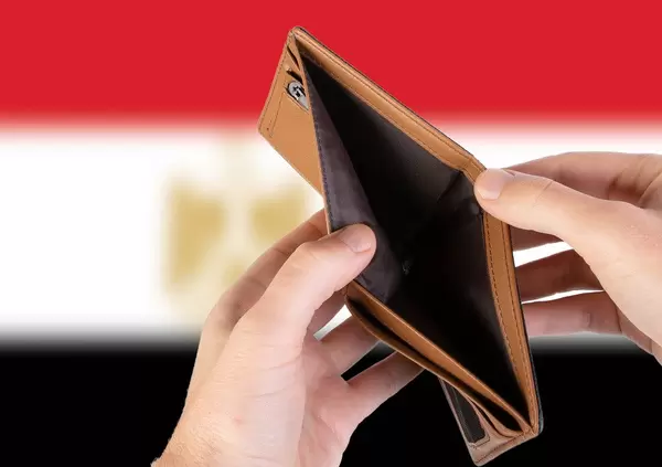 Empty Wallet with Flag of Egypt. Recession and Financial Crisis to come with more debt and federal budget deficit?