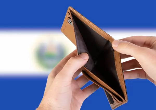 Empty Wallet with Flag of El Salvador. Recession and Financial Crisis to come with more debt and federal budget deficit?