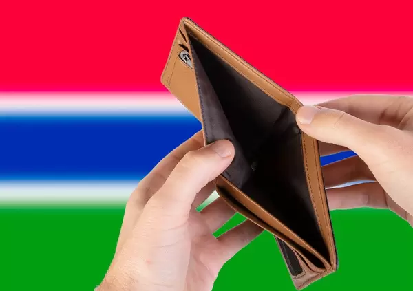 Empty Wallet with Flag of Gambia. Recession and Financial Crisis to come with more debt and federal budget deficit?