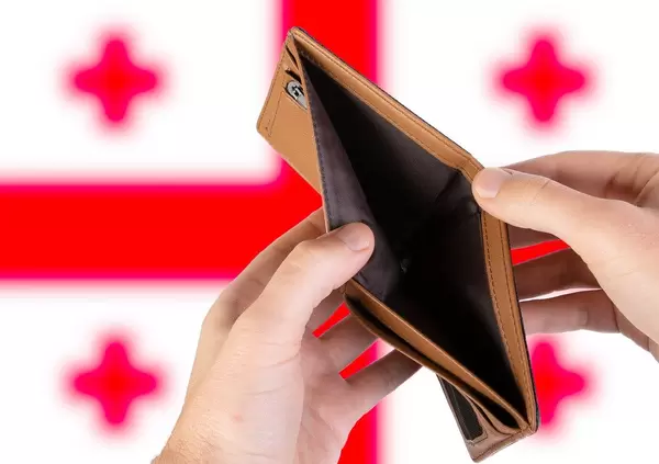 Empty Wallet with Flag of Georgia. Recession and Financial Crisis to come with more debt and federal budget deficit?