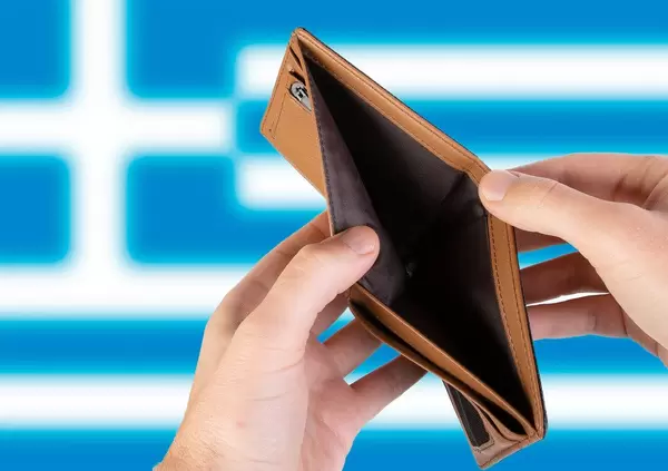 Empty Wallet with Flag of Greece. Recession and Financial Crisis to come with more debt and federal budget deficit?