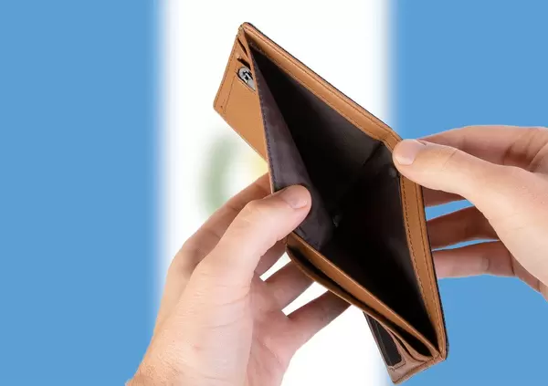 Empty Wallet with Flag of Guatemala. Recession and Financial Crisis to come with more debt and federal budget deficit?