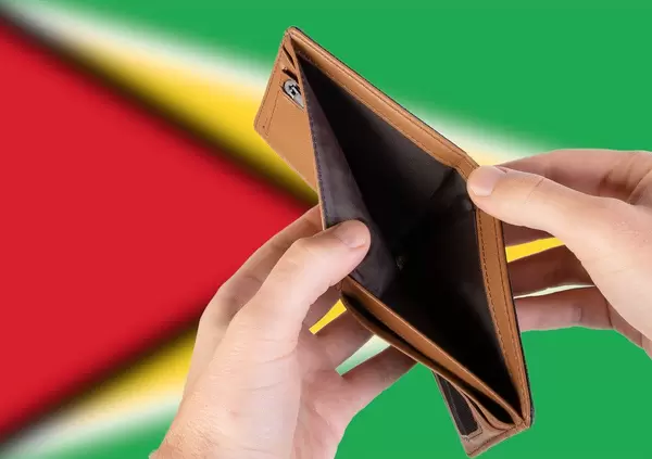 Empty Wallet with Flag of Guyana. Recession and Financial Crisis to come with more debt and federal budget deficit?