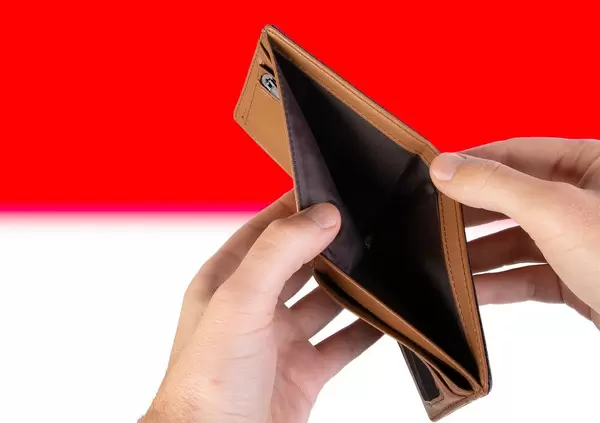 Empty Wallet with Flag of Indonesia. Recession and Financial Crisis to come with more debt and federal budget deficit?