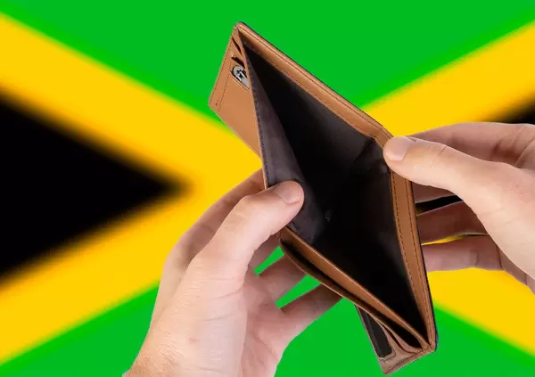 Empty Wallet with Flag of Jamaica. Recession and Financial Crisis to come with more debt and federal budget deficit?