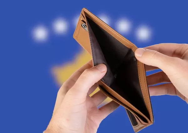 Empty Wallet with Flag of Kosovo. Recession and Financial Crisis to come with more debt and federal budget deficit?