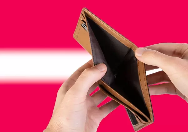 Empty Wallet with Flag of Latvia. Recession and Financial Crisis to come with more debt and federal budget deficit?