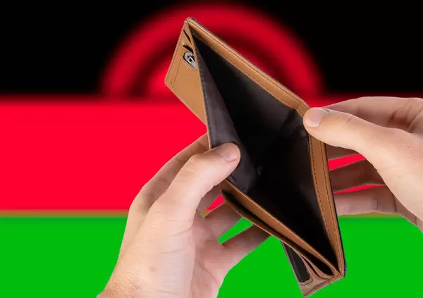 Empty Wallet with Flag of Malawi. Recession and Financial Crisis to come with more debt and federal budget deficit?