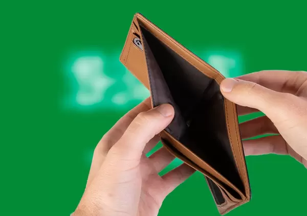 Empty Wallet with Flag of Saudi Arabia. Recession and Financial Crisis to come with more debt and federal budget deficit?