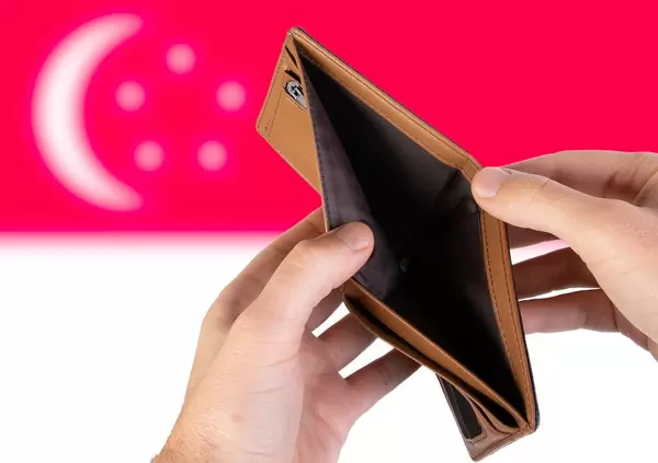 Empty Wallet with Flag of Singapore. Recession and Financial Crisis to come with more debt and federal budget deficit?