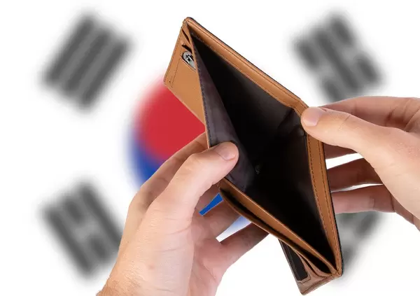 Empty Wallet with Flag of South Korea. Recession and Financial Crisis to come with more debt and federal budget deficit?