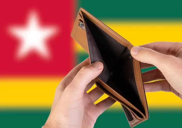 Empty Wallet with Flag of Togo. Recession and Financial Crisis to come with more debt and federal budget deficit?