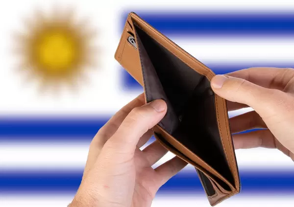 Empty Wallet with Flag of Uruguay. Recession and Financial Crisis to come with more debt and federal budget deficit?