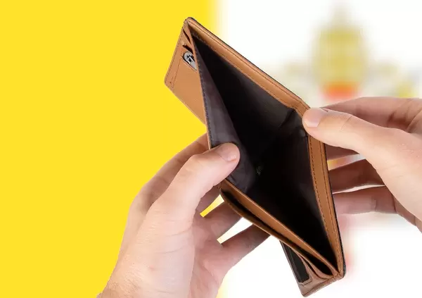 Empty Wallet with Flag of Vatican City. Recession and Financial Crisis to come with more debt and federal budget deficit?