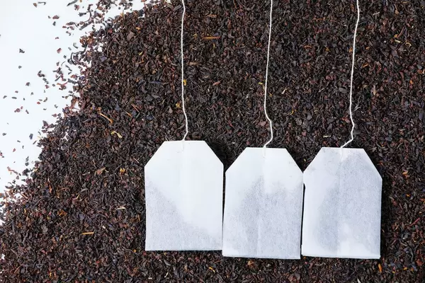 English Breakfast tea bags, dry tea background