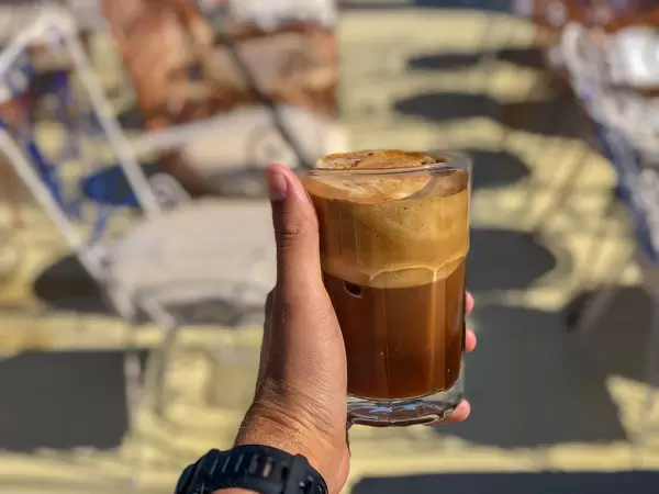 Enjoying Freddo Cappuccino on a warm summer day