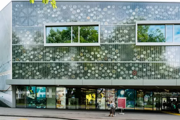 Entrance to the Swiss museum of transportation with multitude of car rims