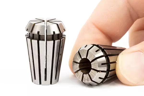 ER collets in the hand above white background