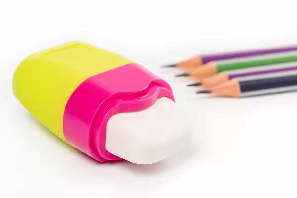 Eraser with simple pencils on white