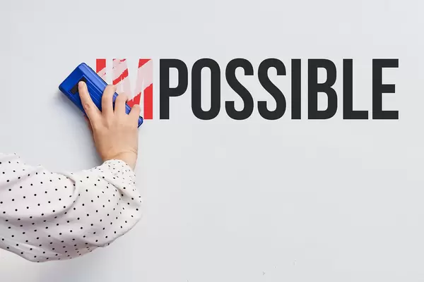 Erasing part of the text on the whiteboard, turning impossible to possible