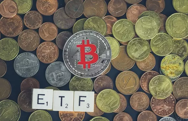 ETF text with silver Bitcoin