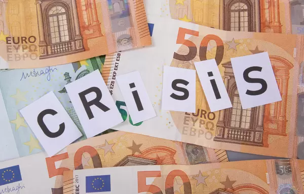 Euro banknotes and Crisis text