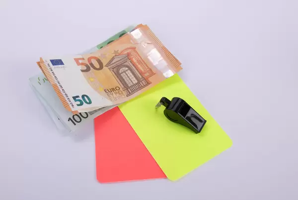 Euro banknotes with red and yellow referee cards