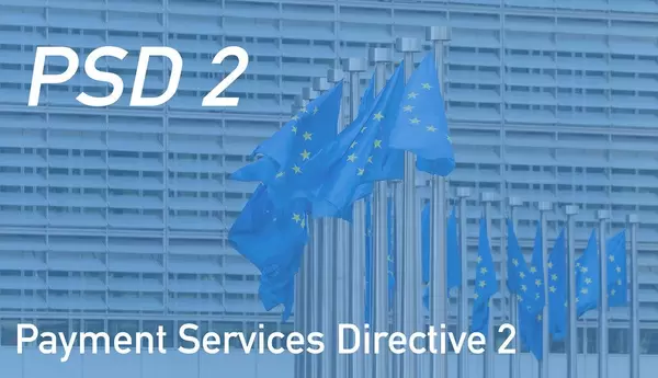 Europäische Flaggen mit dem Text zur Zahlungsdiensterichtlinie "PSD 2 -  Payment Services Directive 2"
