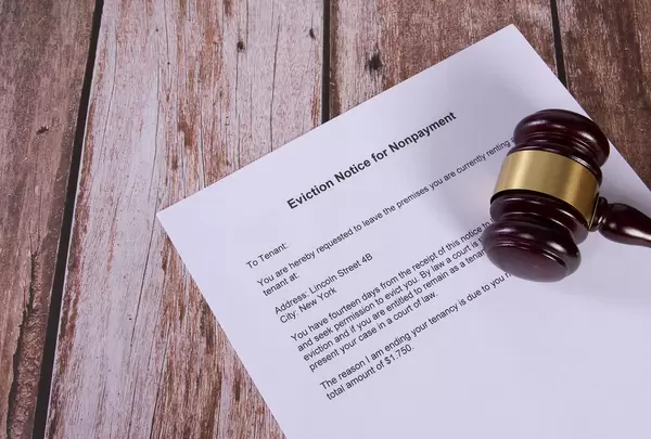 Eviction Notice for Nonpayment document with a wooden judge gavel