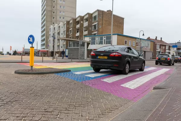 Exceptional pedestrian stripe in purple, blue, green, yellow, orange and red in Zandvoort, Netherlands