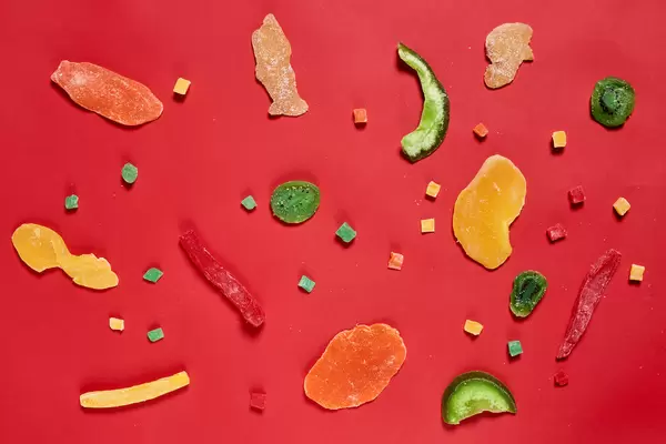 Exotic dried fruits on red background
