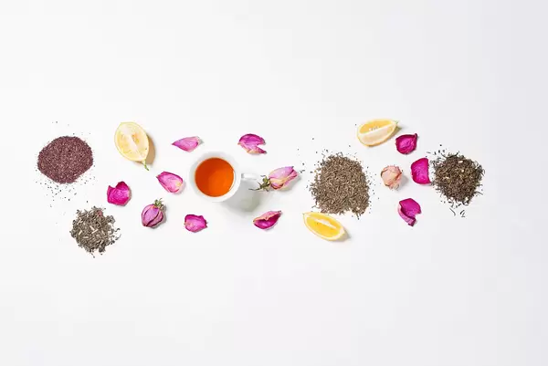 Exotic tea with flower petals and lemon slices