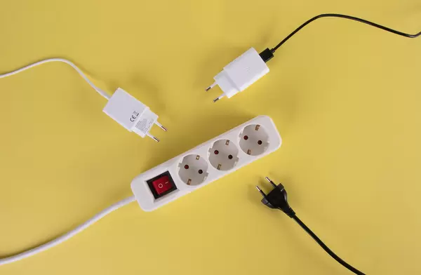 Extension cord on yellow background