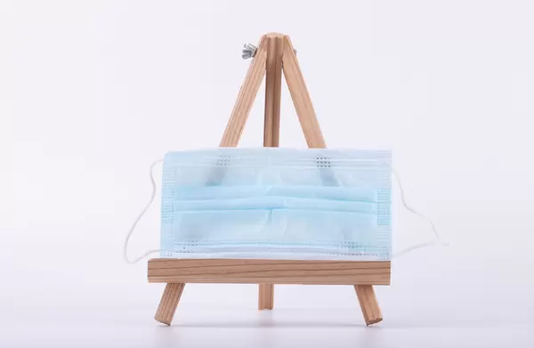 Face mask on a canvas stand