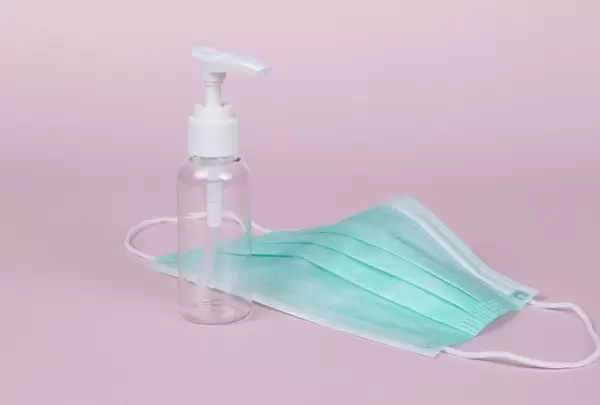 Face mask with sanitizer