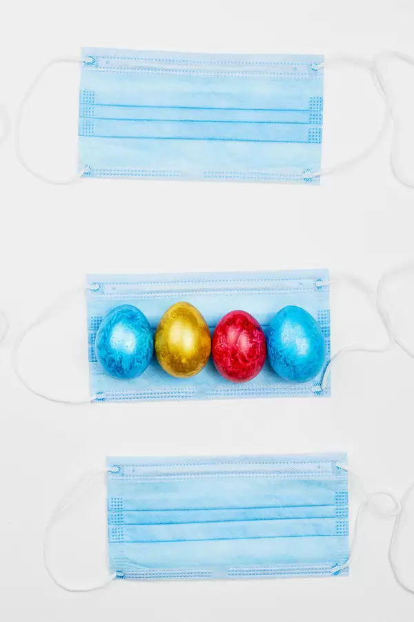 Face masks and colorful Easter eggs