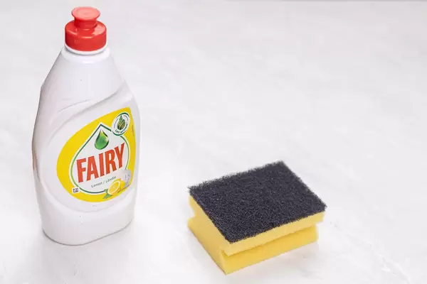 Fairy detergent bottle with Dish Sponge with copy space