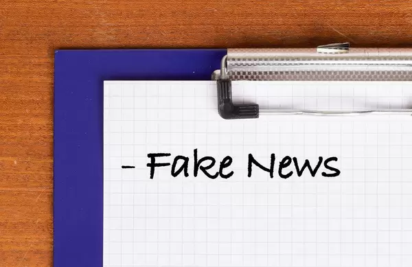 Fake News text on clipboard