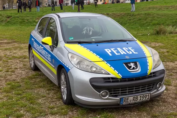 Fake police car with "Friedensfahrzeug - Peace" writing at Cologne protest against Covid restrictions