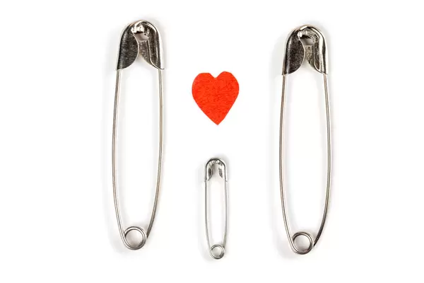 Family concept - mom, dad and baby made of pins