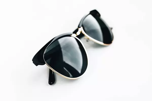 Fashionable sunglasses on white background.