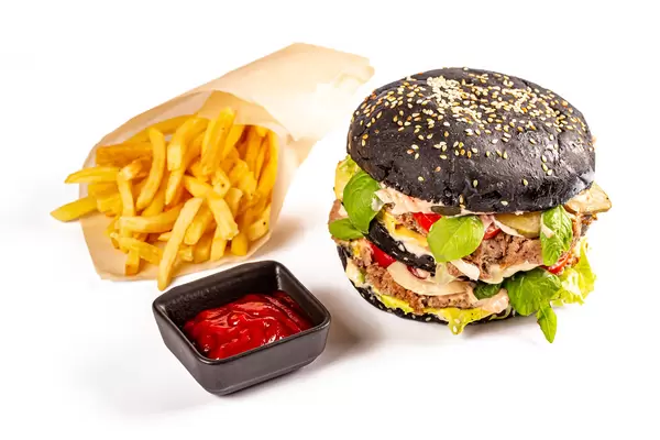 Fast food background with black burger and fries