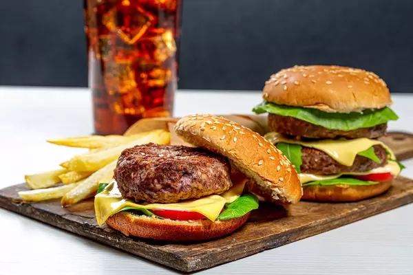 Fast food set on old kitchen Board