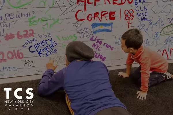 Father and Son signing wall at Marathon Expo New York tbd