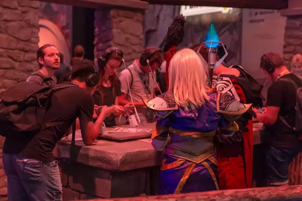Female cosplayer clad as magician at Torchlight Frontiers booth