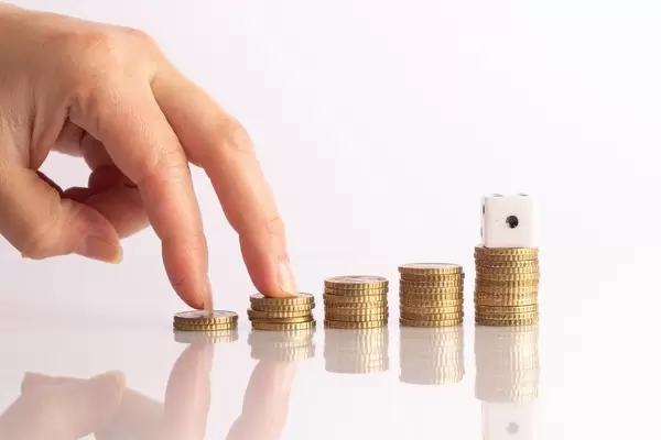 Female hand and coins staircase