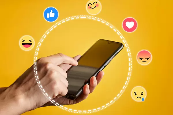 Female hand holding smartphone, surrounded with social media icons