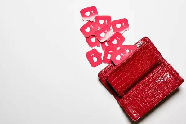 Female hand wallet many paper-cut love signs