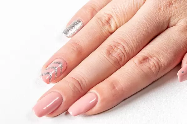 Female hand with long nails and manicure (Flip 2019)